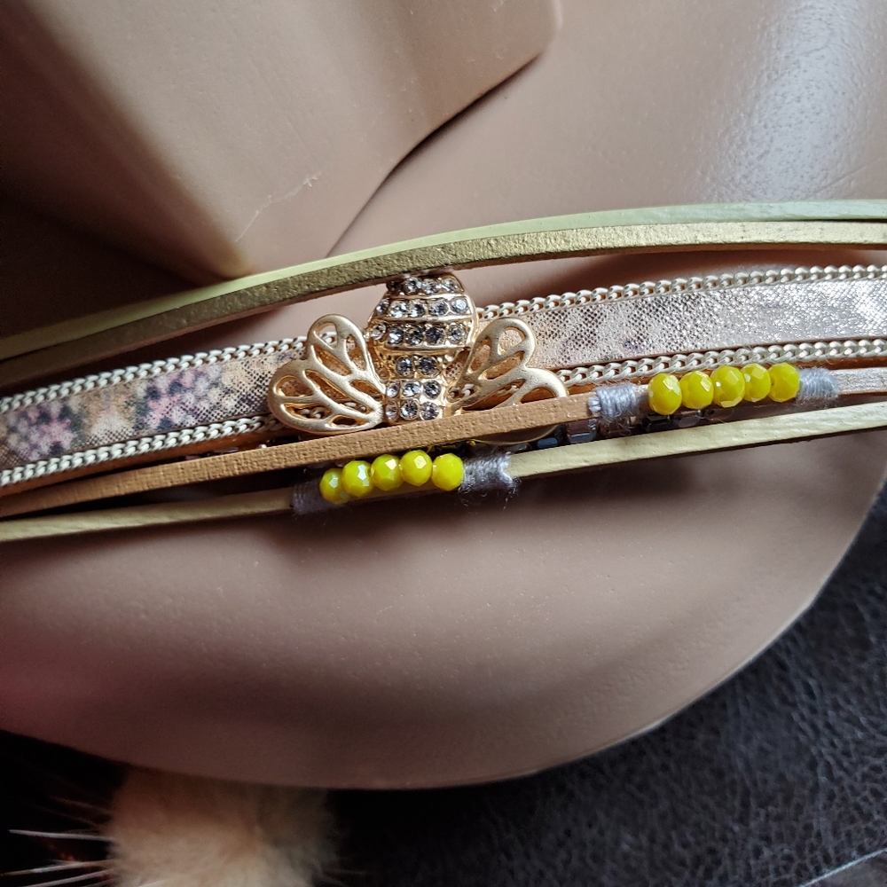 This is such a unique bracelet  With a gold bee